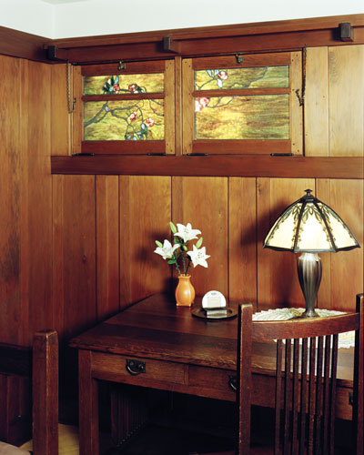 
The Greene and Greene design window in the Anahata room is accented with a small Tiffany lamp on a Gustav Stickley spindle desk.
